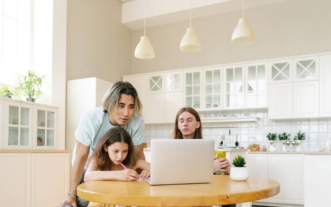 Family learning together at kitchen table